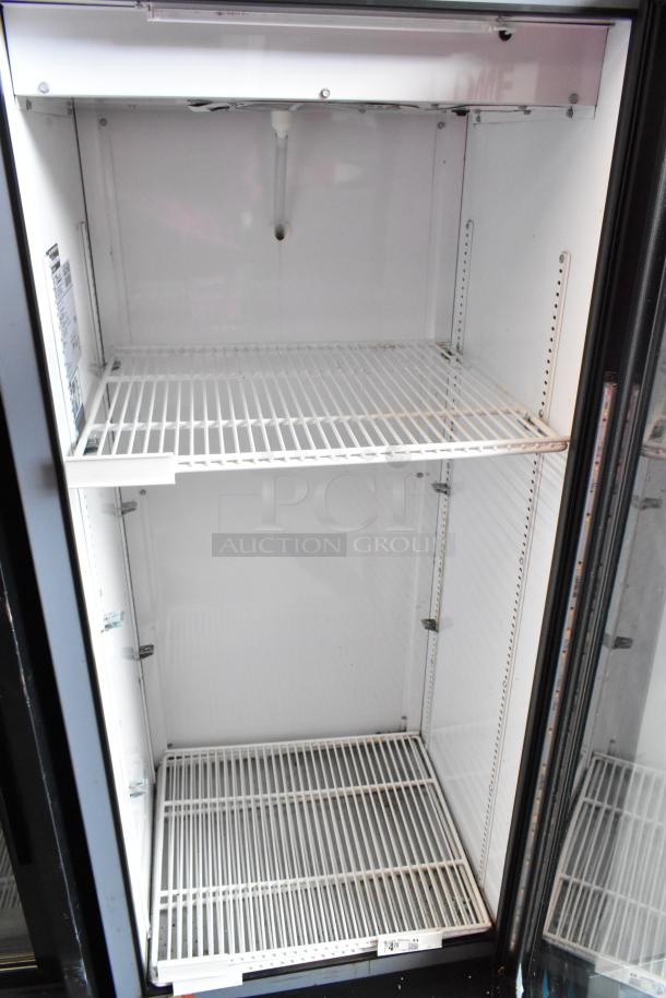 2018 True GDM-12-HC commercial cooler, single glass door, poly-coated racks, excellent condition, 115 volts, 1 phase.
