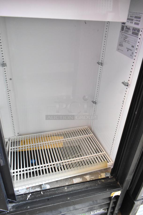 2017 True GDM-41SL-48-HC-LD cooler, commercial 2-door, poly-coated racks, model info tag visible, clean interior.