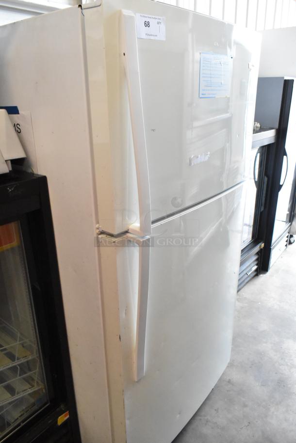 Whirlpool WRT511SZDW00 reach-in cooler with freezer, 115 volts, 1 phase. Visible wear, white exterior, model label present.