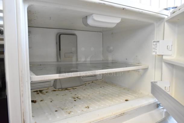 Whirlpool WRT511SZDW00 reach-in cooler with freezer, 115 volts, 1 phase, visible wear and interior residue.