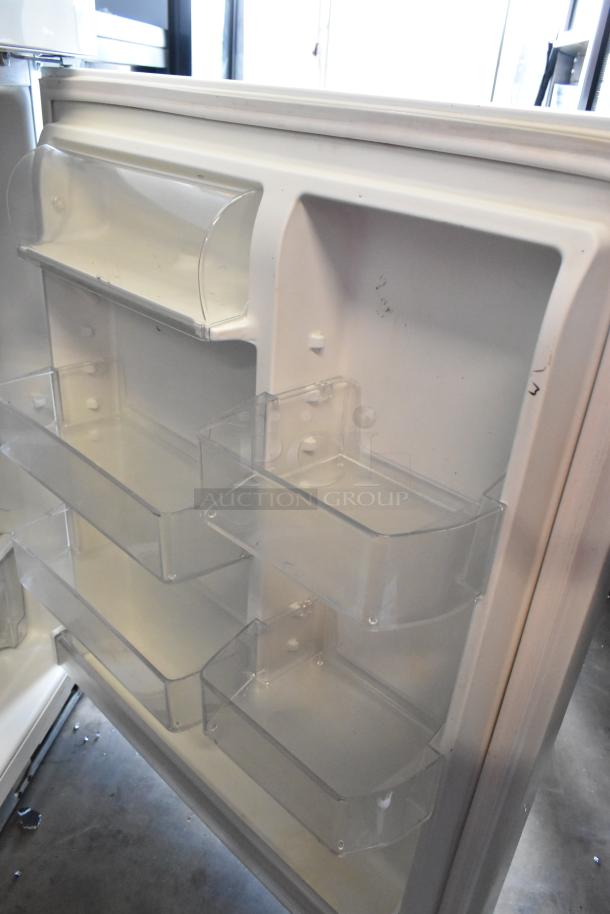 Whirlpool WRT511SZDW00 cooler freezer door shelves, clear plastic, 115 volts, 1 phase, showing interior condition.