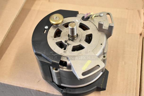 A mechanical component, not the Bizerba SE 12 US commercial meat slicer. Visible metal parts, wires, and mounting features.