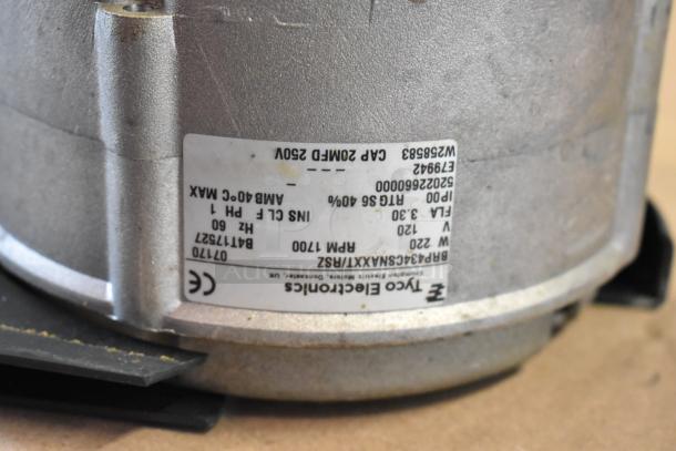 Bizerba SE 12 US commercial meat slicer label, showing specifications: 115V, 1 phase. Silver finish, worn condition.