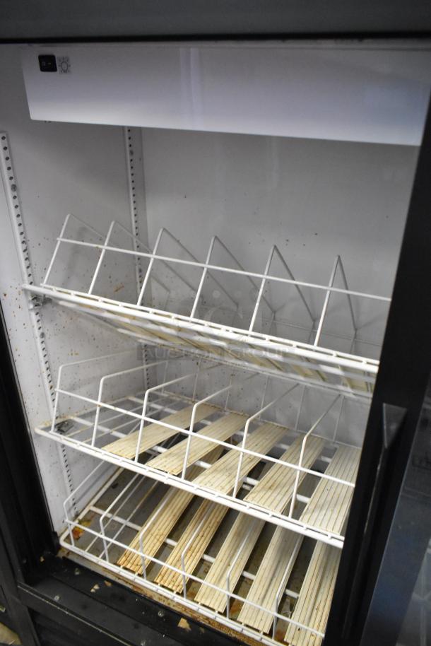 2018 True GDM-41SL-48-HC-LD 2-door cooler with poly-coated racks, visible wear, 115V, 1 phase, commercial use.