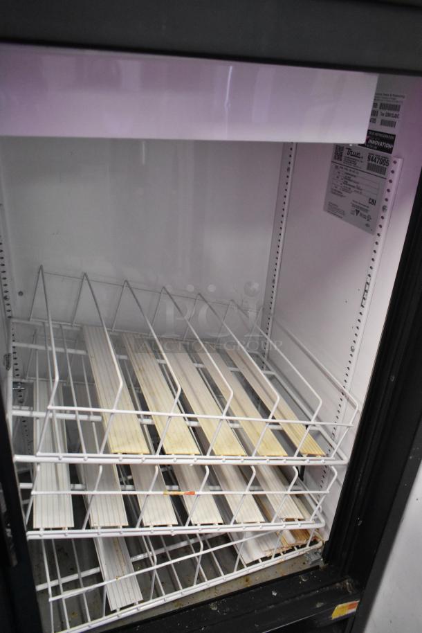 2018 True GDM-41SL-48-HC-LD 2 Door Cooler with poly-coated racks. Visible label details specifications. Condition appears used.
