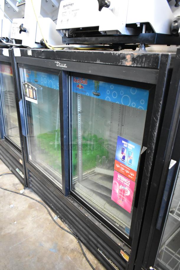 2018 True GDM-41SL-48 2 Door Cooler Merchandiser, glass front, metal frame, visible wear, Red Bull branding, 115V, 1 Phase.