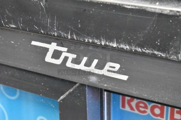 2018 True GDM-41SL-48-HC-LD cooler, metal frame, scratched surface, visible "True" logo. Perfect for commercial use.