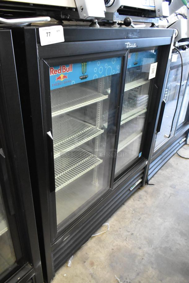 True GDM-41SL-54-HC-LD commercial cooler with 2 glass doors, poly-coated racks, 115V, 1 phase. Branded interior.