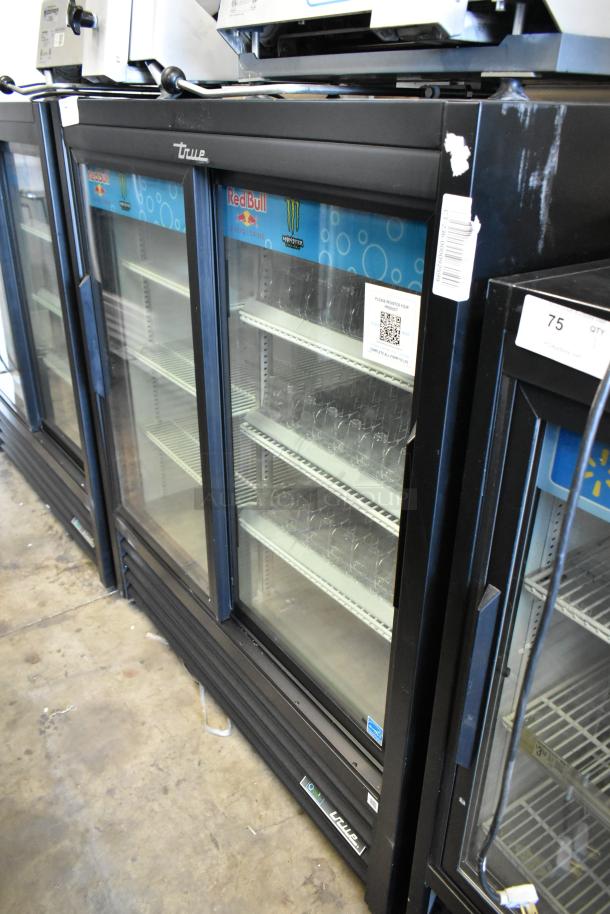 2025 True GDM-41SL-54-HC-LD metal commercial 2-door cooler, poly coated racks, labels visible, 115 Volts, 1 Phase.