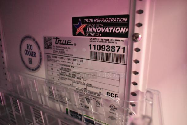True GDM-41SL-54-HC-LD cooler label showing serial number 11093871, eco cooler sticker, and specifications.