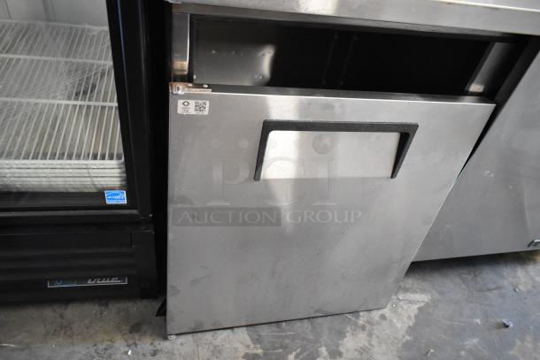 2017 True TPP-67 stainless steel pizza prep table with commercial casters. Features a single door, 115V, 1 phase. Slight wear visible.