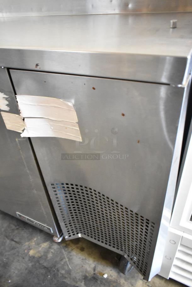 2017 True TPP-67 stainless steel commercial pizza prep table, 115V, 1 phase, on casters, showing minor wear and labels.