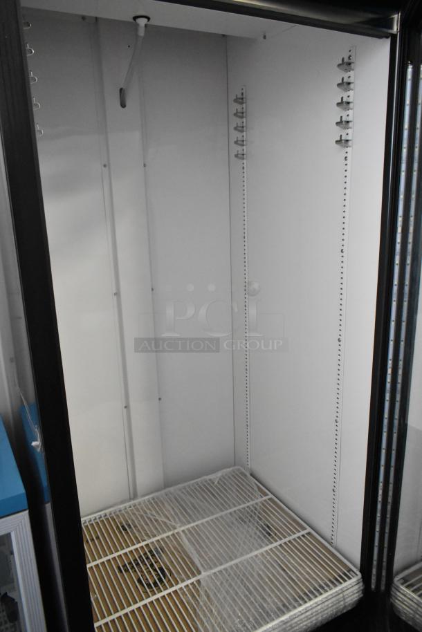 2021 True GDM-26-HC single door cooler, metal, poly-coated racks, 115 volts, 1 phase, excellent condition.