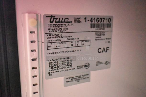 True TWT-72 stainless steel commercial pizza prep table label, 115 volts, 1 phase, model info, NSF certified.