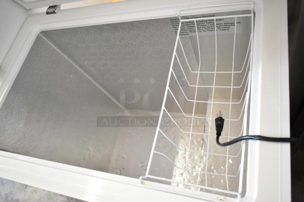 Arctic King ARC070S0aRWW Metal Chest Freezer, hinged lid open, white interior, grid basket, 115V, 1 phase plug.