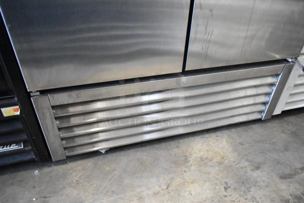 2017 True T-35-HC stainless steel commercial 2-door reach-in cooler with poly-coated racks, 115 volts, 1 phase.