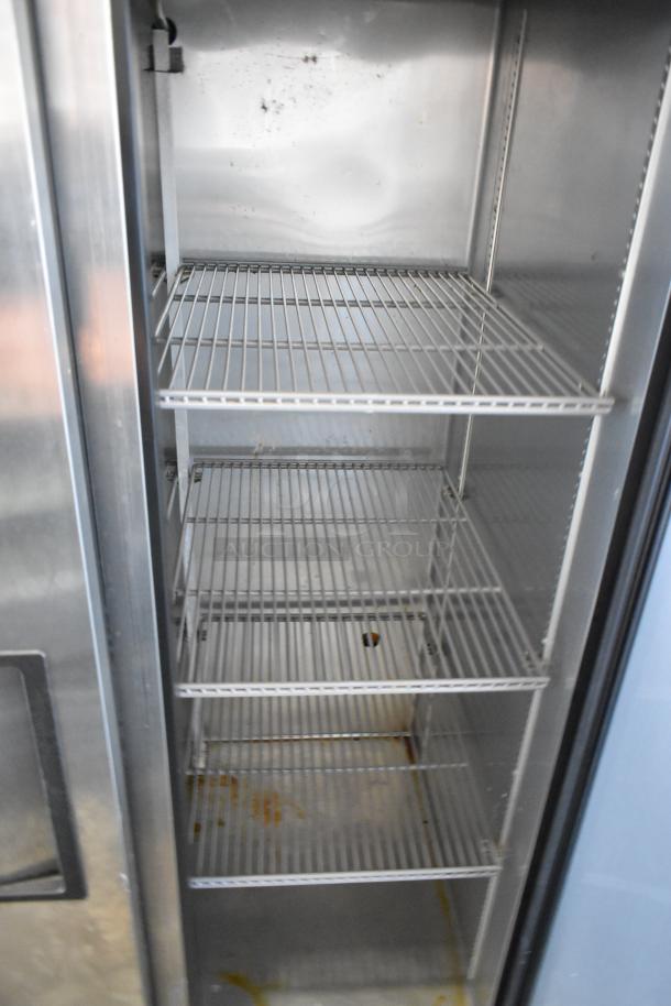 2017 True T-35-HC stainless steel 2-door reach-in cooler, features polly coated racks, 115 volts, 1 phase power.