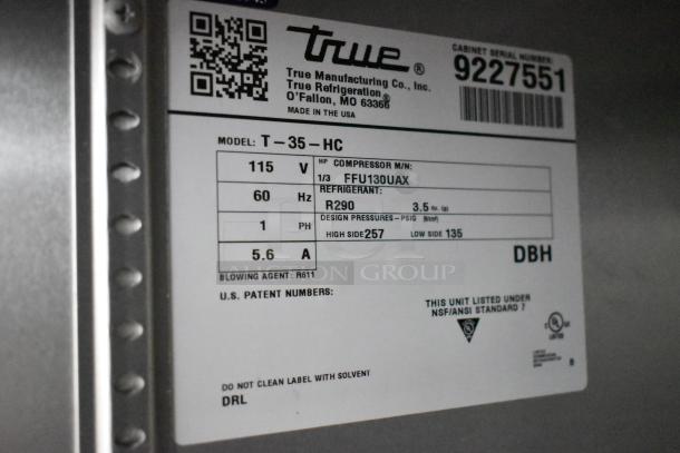 2017 True T-35-HC stainless steel commercial cooler, 2-door, with polly coated racks. Model label details voltage and refrigerant.
