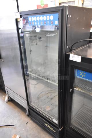 True GDM-12 metal commercial single door reach-in cooler merchandiser with poly-coated racks, 115 volts, 1 phase.