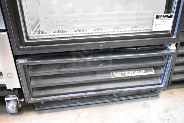 True GDM-12 single door cooler merchandiser, metal frame, poly coated racks, 115 volts, 1 phase, visible warranty info.