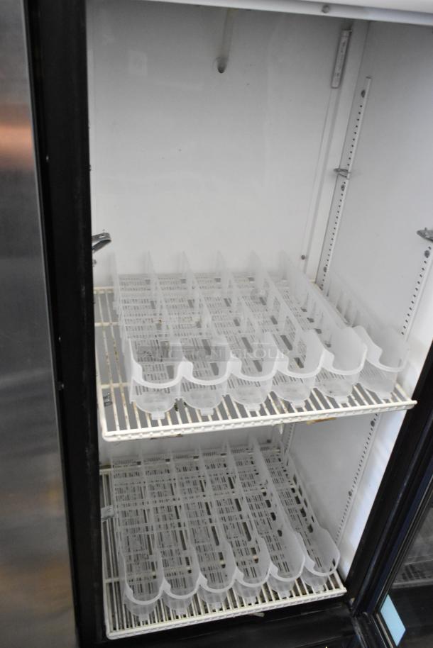 True GDM-12 commercial reach-in cooler with single glass door, poly-coated racks, metal body, 115V, 1 Phase, good condition.
