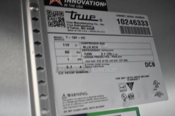 Label on a 2021 True T-19F-HC commercial freezer, showing model, voltage, refrigerant type, and pressure specifications.