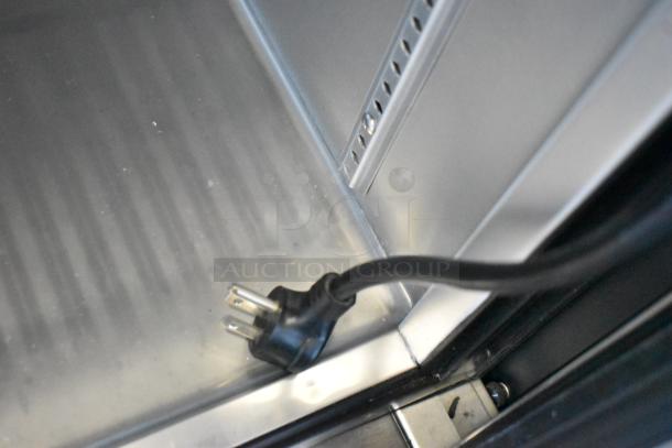 2021 True T-19F-HC stainless steel interior, showing a power cord. Features poly-coated racks, commercial casters, 115V, 1 Phase.
