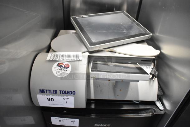 Mettler Toledo UCCW metal commercial countertop food portioning scale, 100-240V, with visible inspection sticker and barcode tag.
