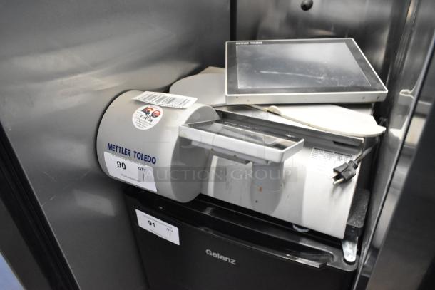 Mettler Toledo UCCW stainless steel food portioning scale, 100-240 volts, with digital display. Fair condition, visible labels.