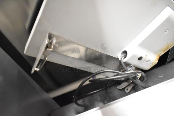 Mettler Toledo UCCW metal commercial countertop food portioning scale, showing power cord and mounting hardware, 100-240V, 1 phase.