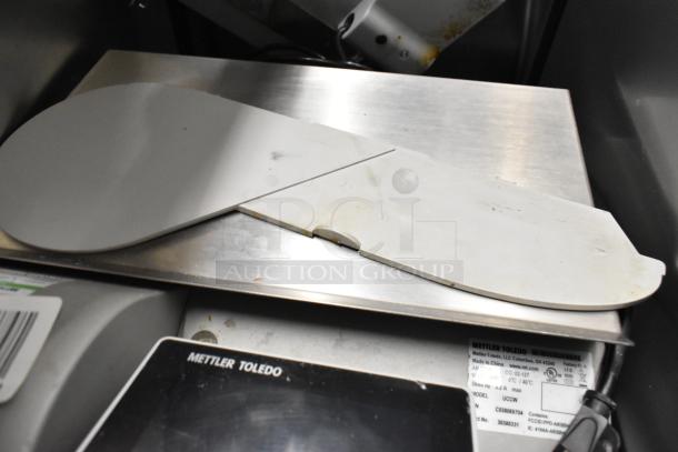 Mettler Toledo UCCW commercial countertop food portioning scale, metal finish, visible label, 100-240 Volts, 1 Phase.