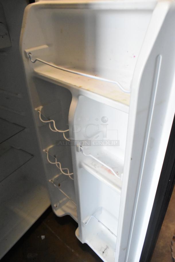 Galanz GLR33MBKE23 mini cooler interior view, showing shelves and door storage. Good condition, 115 volts, 1 phase.
