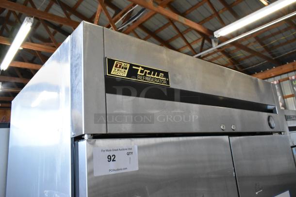 2016 True T-35 stainless steel commercial cooler, 2 doors, poly coated racks, on casters. Model visible: "True Refrigerator".