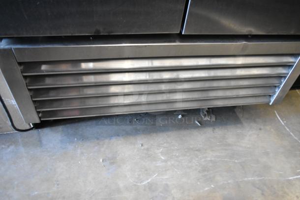 2016 True T-35 stainless steel 2-door reach-in cooler, poly-coated racks, commercial casters. 115V, 1 phase.