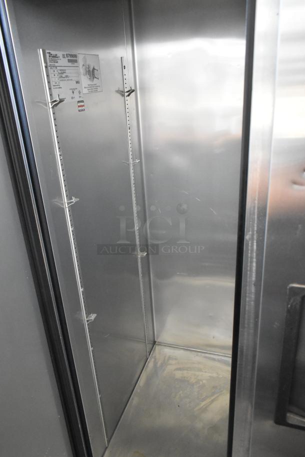 2016 True T-35 stainless steel 2-door reach-in cooler, poly coated racks, commercial casters, 115V, 1 phase. Model and serial on label.