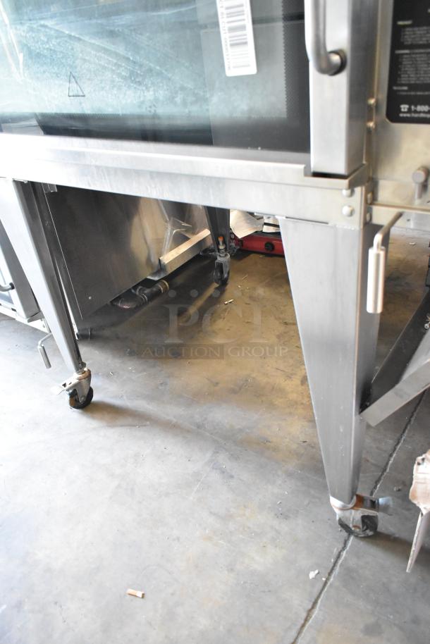 Hardt Inferno 3500 stainless steel rotisserie oven on commercial casters, 40 bird capacity, 76,000 BTU, natural gas powered.