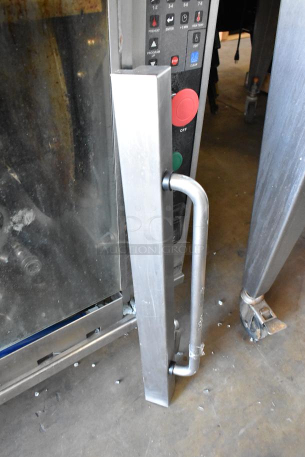 Hardt Inferno 3500 stainless steel rotisserie oven, 76,000 BTU, 40-bird capacity, controls visible, on commercial casters.