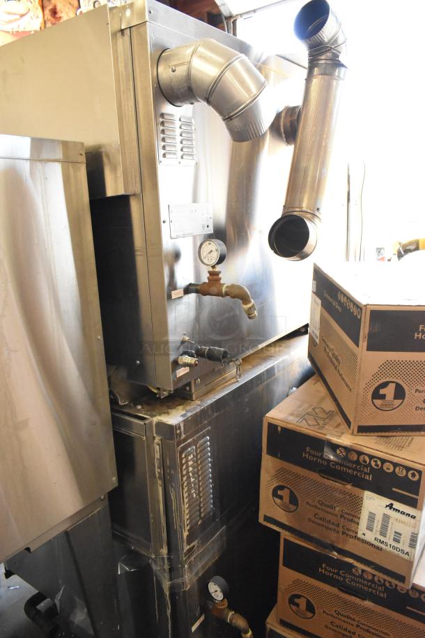 2 Hardt Inferno 3500 stainless steel commercial rotisserie ovens on casters, 40 bird capacity each, natural gas, 76,000 BTU.
