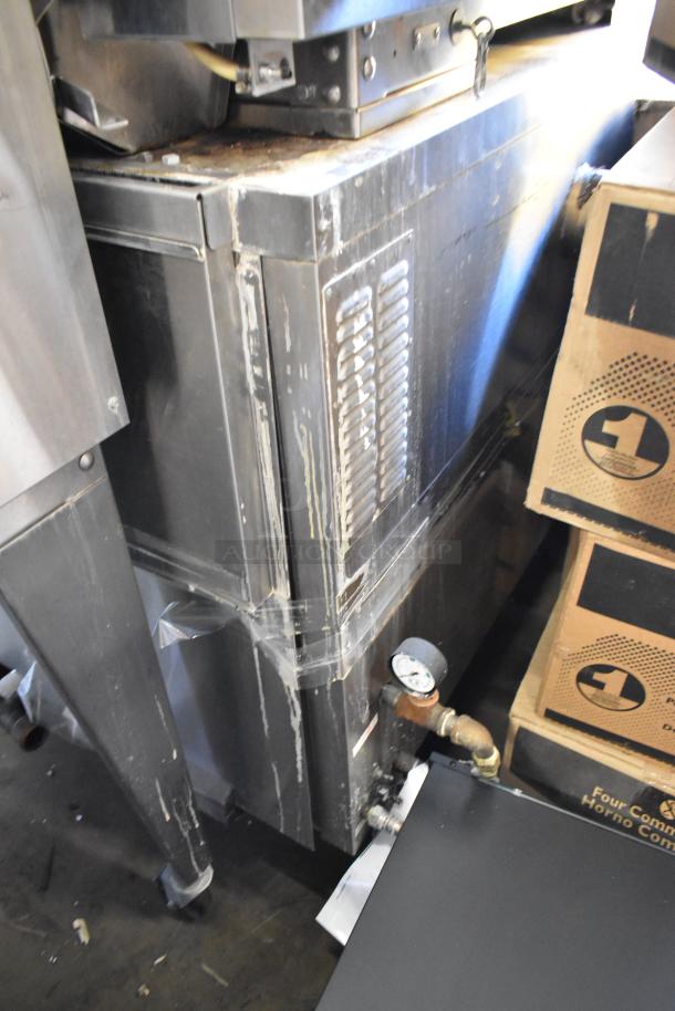 2 Hardt Inferno 3500 rotisserie ovens, stainless steel, natural gas, 40-bird capacity each, 76,000 BTU, on commercial casters.