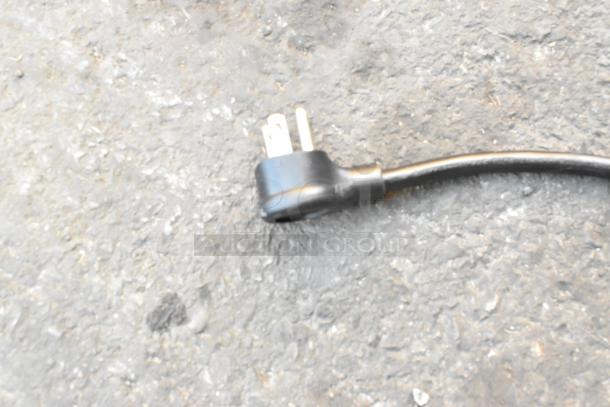 Close-up of the electrical plug for the True GDM-26-HC cooler. Three-prong design suitable for 115 volts, 1 phase.