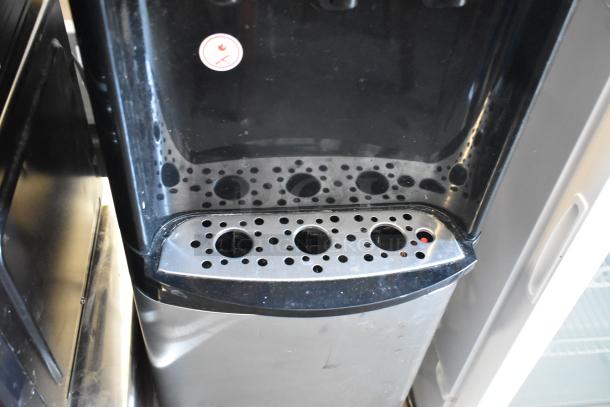 Primo 900130 Water Cooler Base, 115V, 1 phase, sleek black exterior, visible drip tray, in used condition.