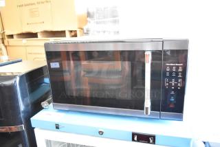 2023 Hamilton Beach HB61B100027880 Metal Countertop Microwave Oven with plate, 115 volts, 1 phase, new condition.