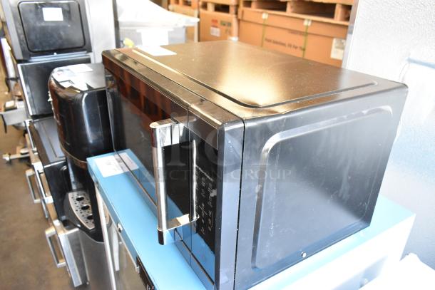 2023 Hamilton Beach HB61B100027880 metal countertop microwave oven with plate, black, 115V, 1 phase, excellent condition.