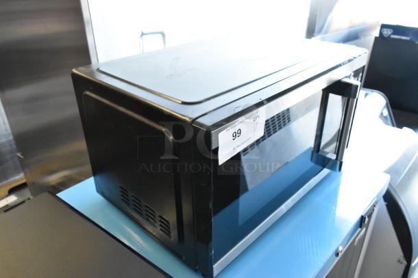 2023 Hamilton Beach countertop microwave, model HB61B100027880, metal design with plate, 115 volts, new condition, auction lot 99.