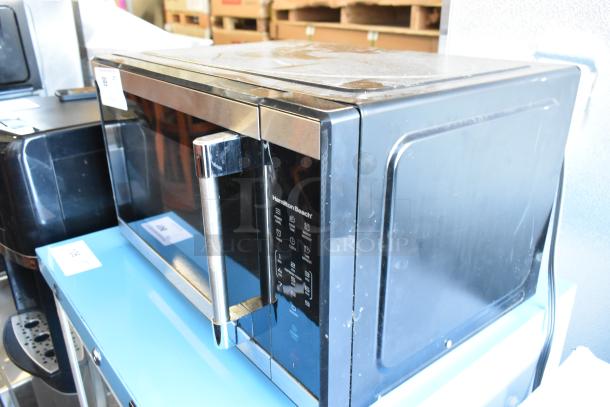2023 Hamilton Beach HB61B100027880 metal countertop microwave oven with control panel. 115V, 1 phase, used condition.