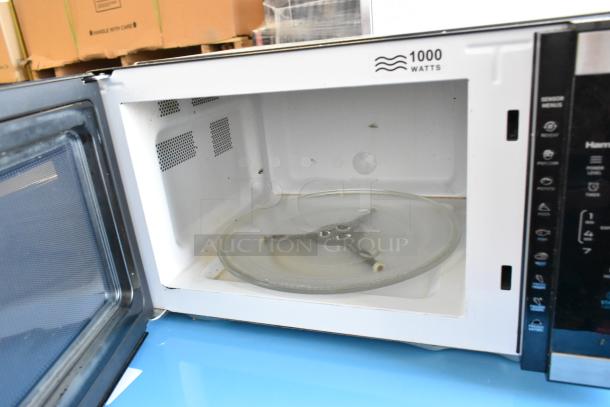Hamilton Beach HB61B100027880 metal countertop microwave oven with plate, 1000 watts, shown open.