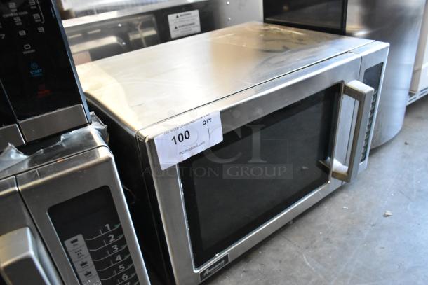 2022 Amana RCS10TS stainless steel commercial countertop microwave oven, 120 volts, 1 phase, used condition, auction label visible.