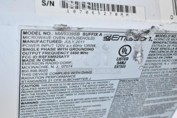 Emerson MW9339SB microwave label showing model details and compliance info. Manufactured July 2011, 120V, 2450 MHz.