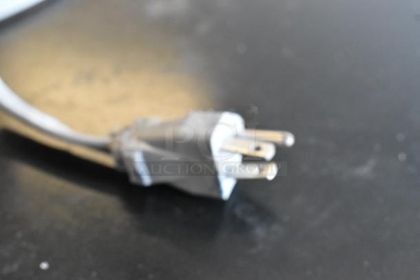 Emerson MW9339SB microwave plug, 115 Volts, 1 Phase, metal countertop model. Power cord close-up.