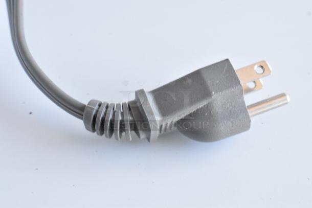 Close-up of a power plug for the Hamilton Beach HB61S100027880 microwave oven.